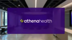 athenahealth logo with white text and green leaf icon on a purple overlay with a blurred office background.