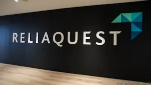 ReliaQuest logo & name on dark wall. Off Campus Drive 2026: Associate Software Engineer for freshers.