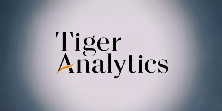 Tiger Analytics logo with black text and an orange swoosh under the 'A'.