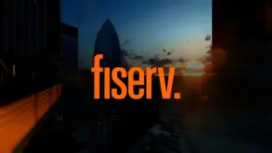 Fiserv logo over the London skyline at sunset featuring The Gherkin building.