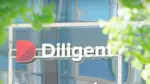 Diligent company name and red D logo on a glass building, with blurred green leaves in the foreground.